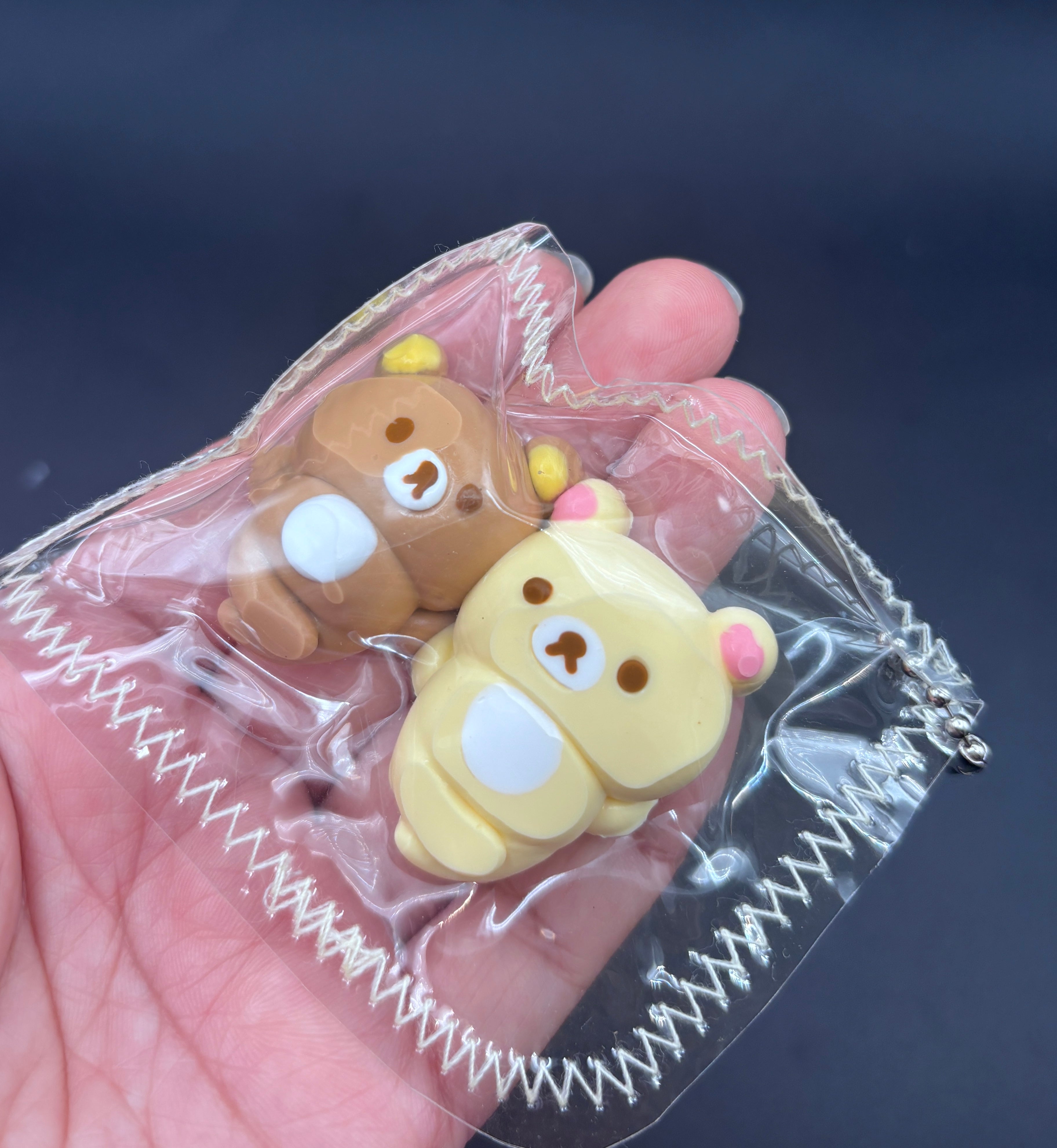 Rilakkuma and Korilakkuma laying down mini Taba keychain