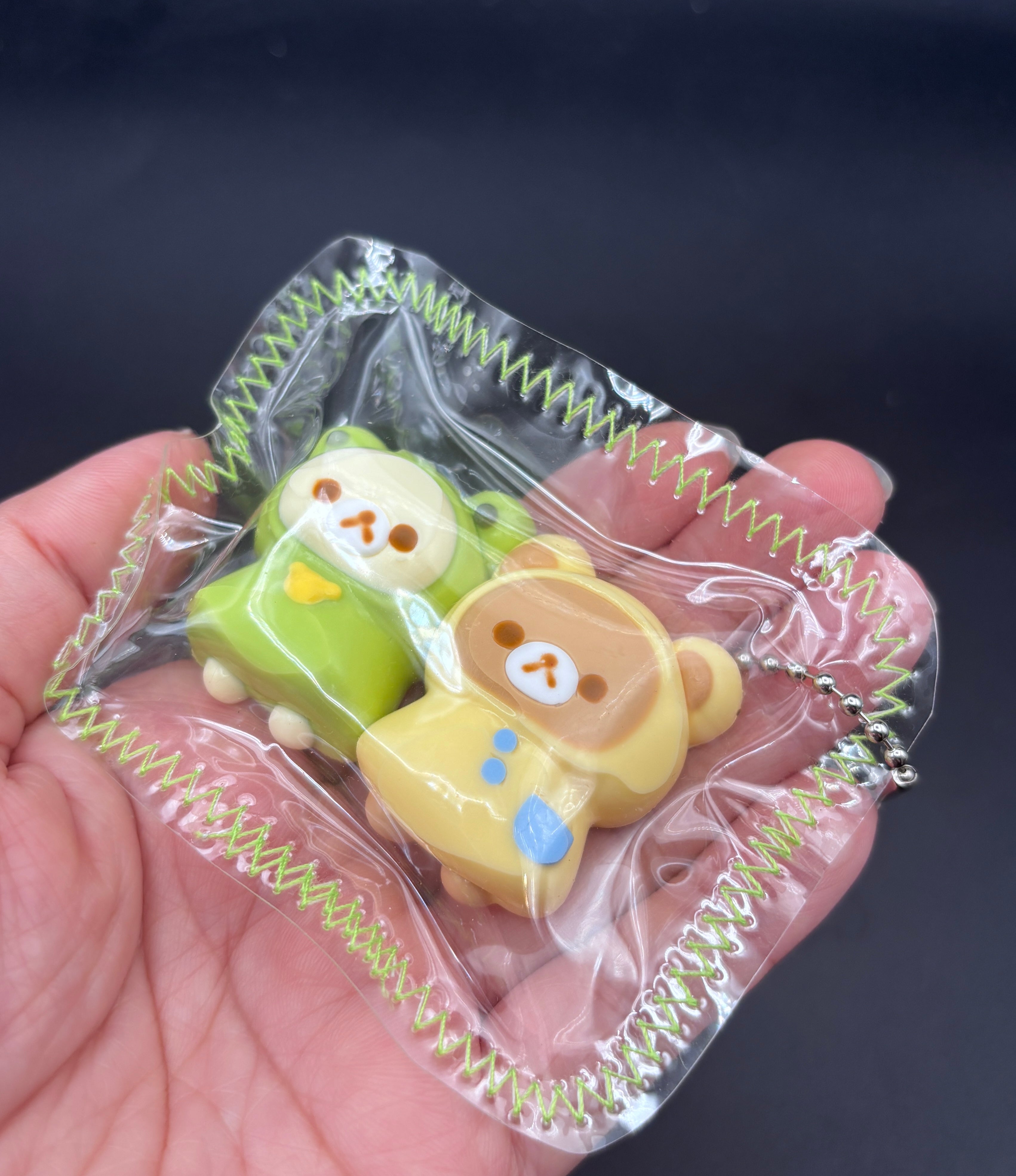 Frog Rilakkuma and Korilakkuma laying down mini Taba keychain