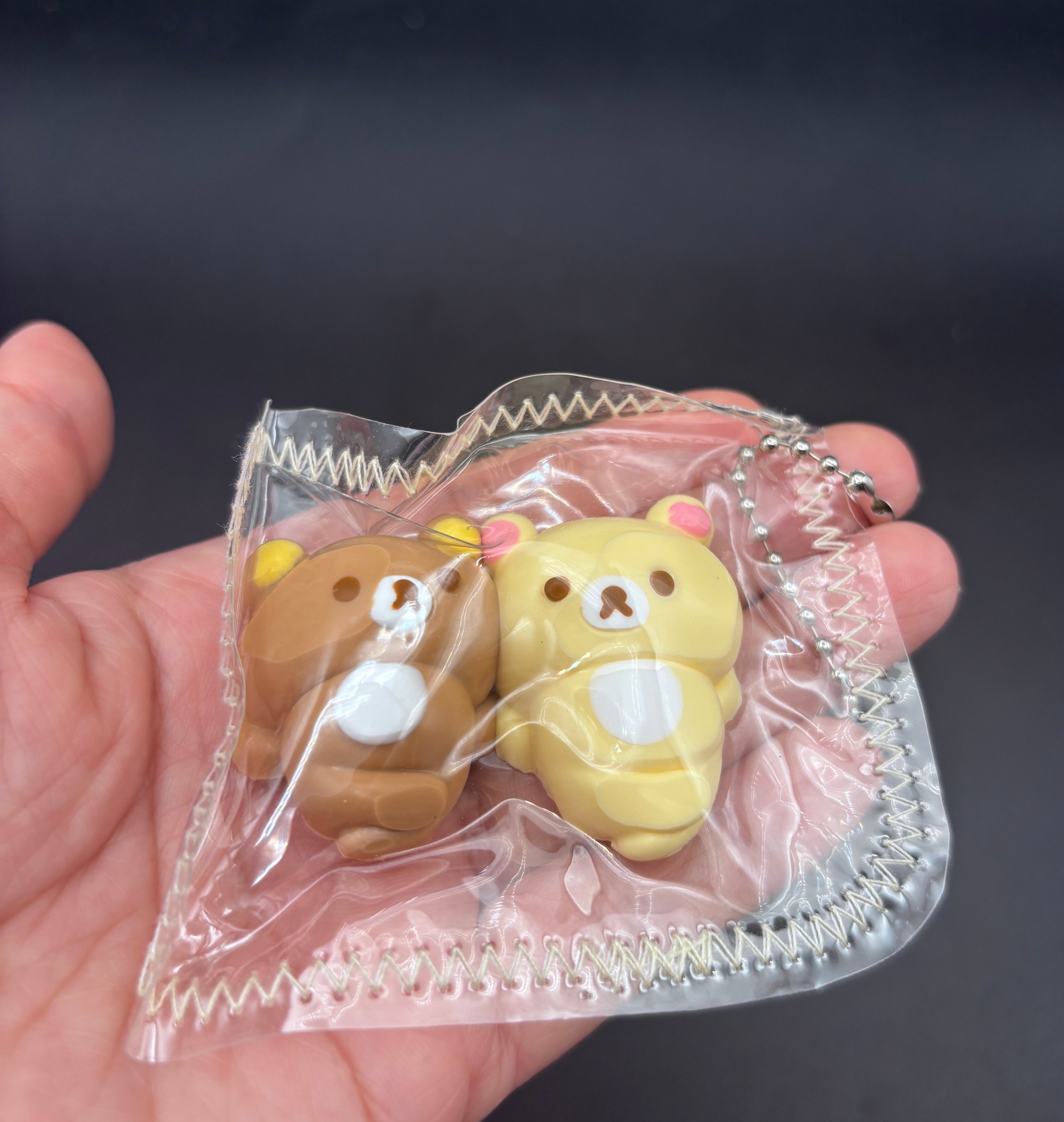 Rilakkuma and Korilakkuma laying down mini Taba keychain