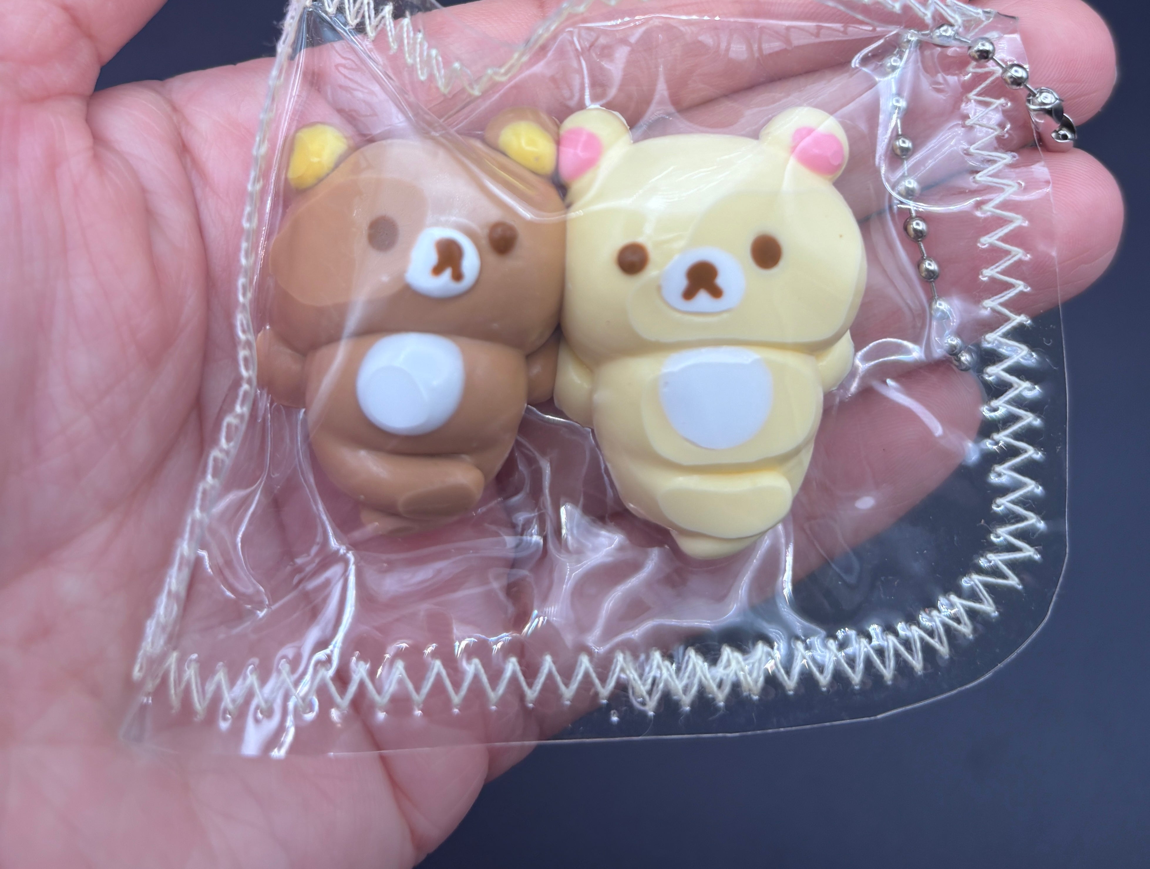 Rilakkuma and Korilakkuma laying down mini Taba keychain