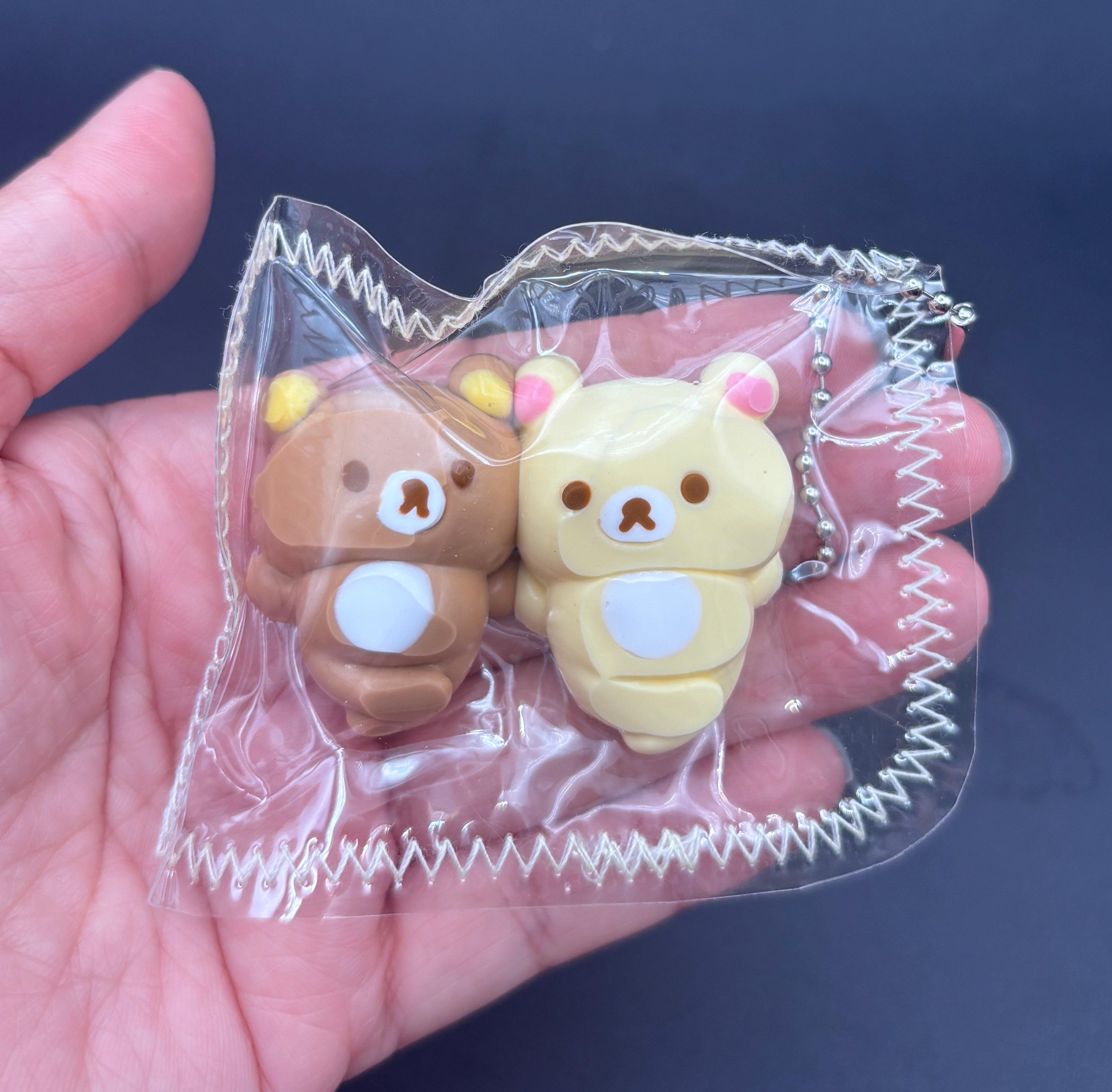 Rilakkuma and Korilakkuma laying down mini Taba keychain