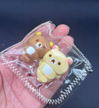 Rilakkuma and Korilakkuma laying down mini Taba keychain