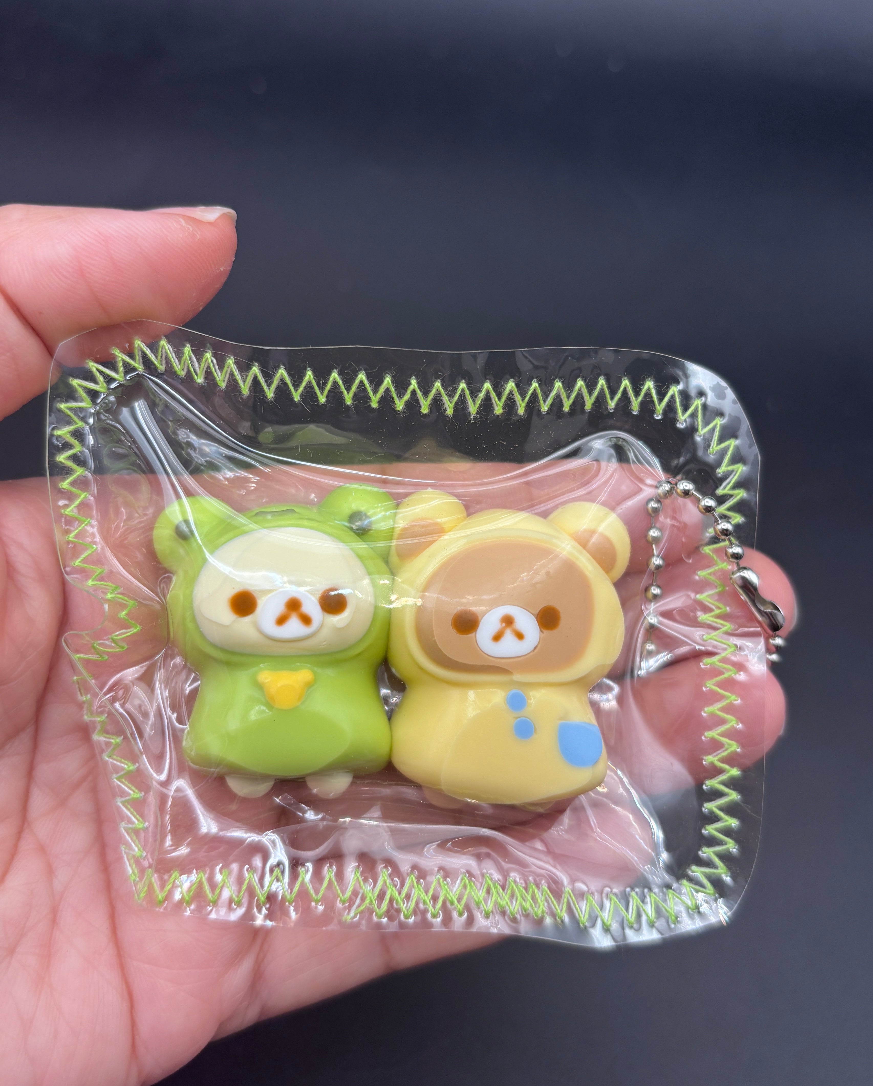 Frog Rilakkuma and Korilakkuma laying down mini Taba keychain