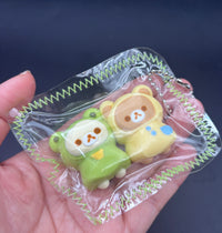 Frog Rilakkuma and Korilakkuma laying down mini Taba keychain