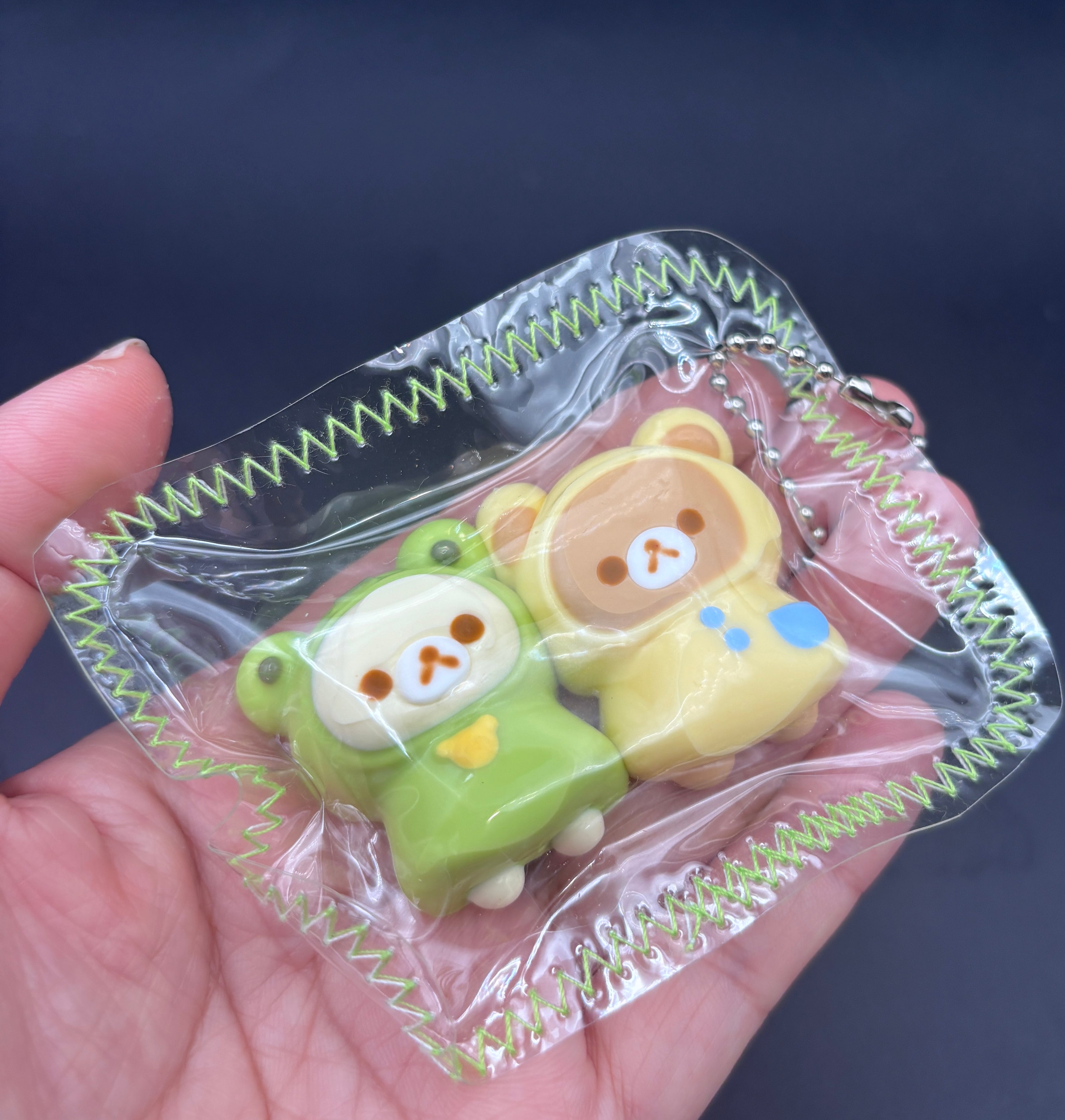 Frog Rilakkuma and Korilakkuma laying down mini Taba keychain