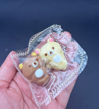 Rilakkuma and Korilakkuma laying down mini Taba keychain