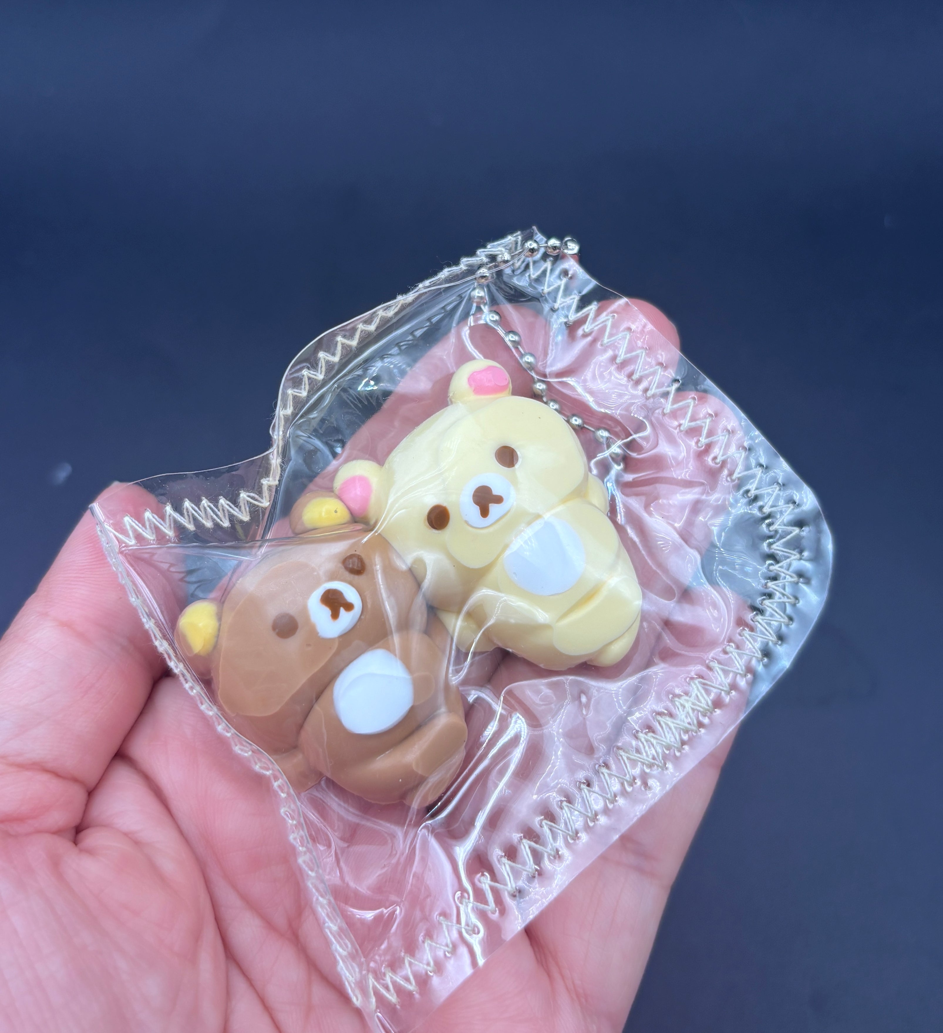 Rilakkuma and Korilakkuma laying down mini Taba keychain