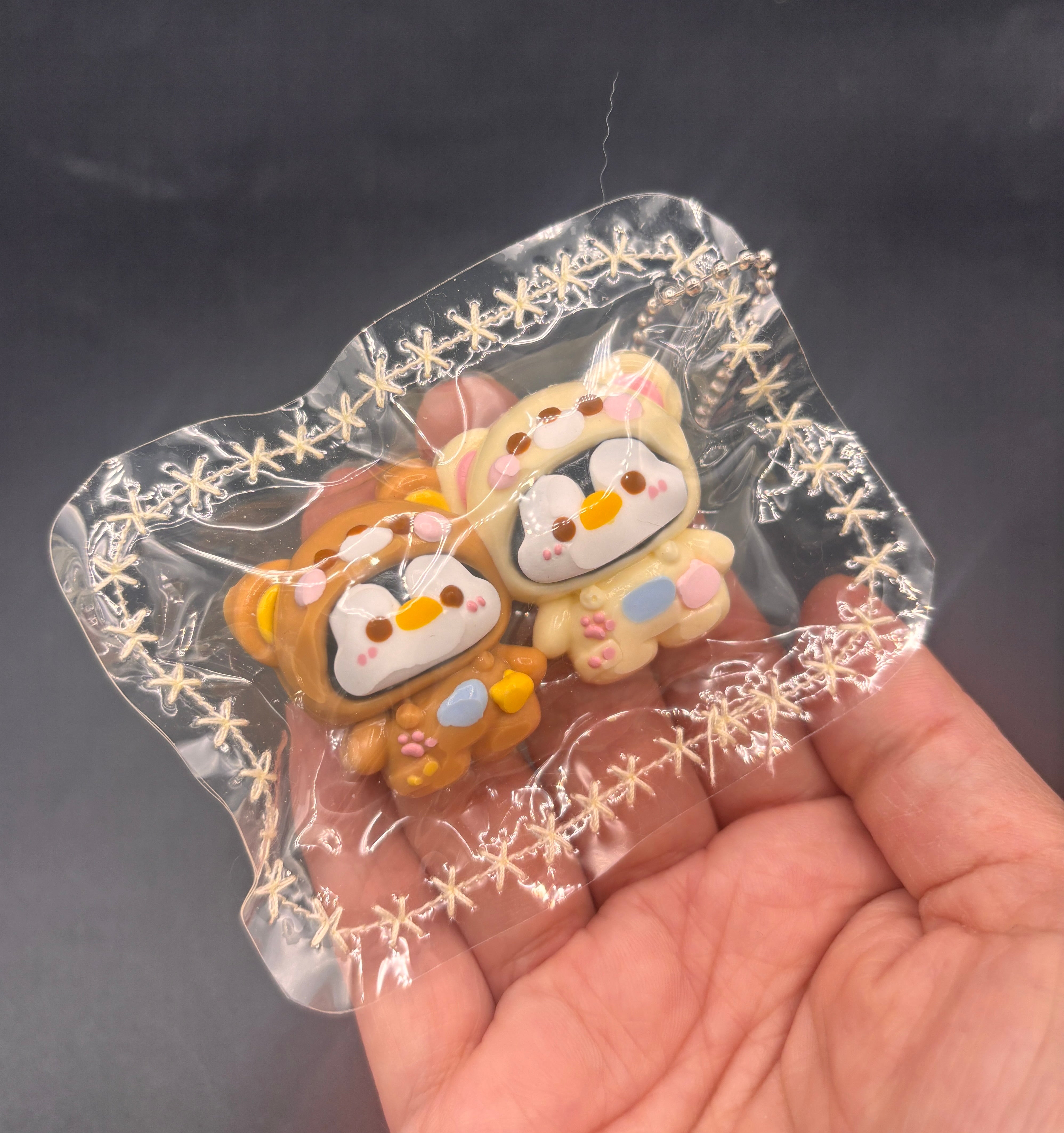 Mini penguin twins in a rila hoodie tab keychain taba squishy